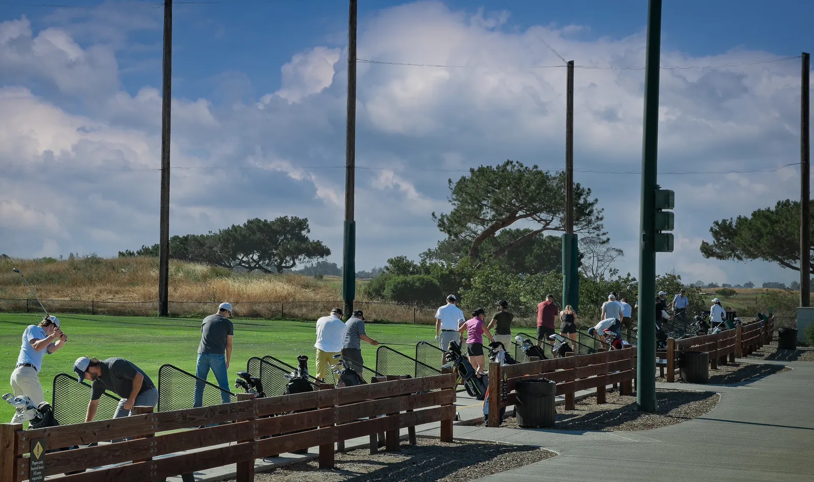 Golfers hitting balls from stalls along the practice range at Baylands Golf Links, Palo Alto.